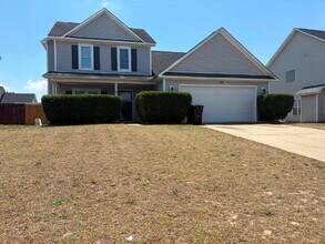 Building Photo - Spacious 4-Bedroom Sanctuary with Cozy Fireplace on Chimney Swift Drive!