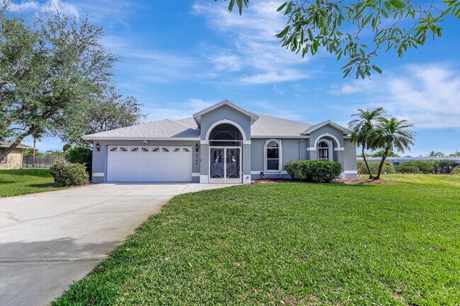 Building Photo - A BOATER'S PARADISE WITH THIS STUNNING 3 BEDROOM, 2 BATH WATERFRONT POOL HOME W/DOCK & BOAT LIFT ...