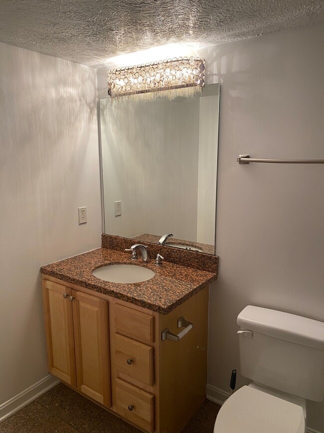 Primary Full Bathroom with Custom Lighting, Granite Countertops and Marble Flooring - 2222 Detroit Ave