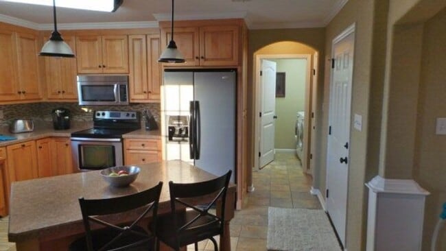 Building Photo - Modern Elegance Meets Spacious Comfort: 4B...