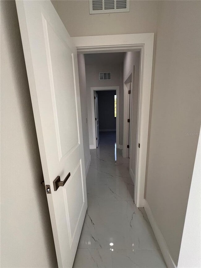 Building Photo - Be the first in occupy this 2025 constructed home in the vibrant city of Port Charlotte, FL! Qual...