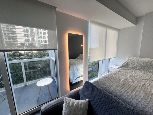 Building Photo - 10275 Collins Ave