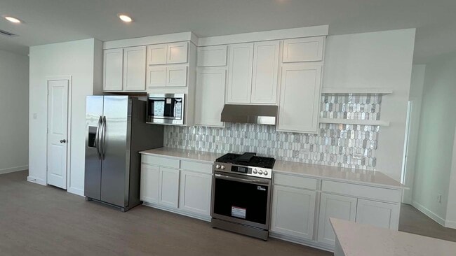 Building Photo - 27451 Sunterra Village Dr