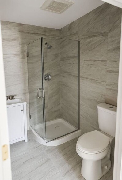 renovated bathroom, featuring updated plumbing fixtures and modern finishes. Clean lines, quality ma - 2578 W 18th Pl
