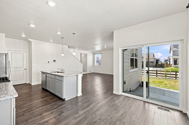 Building Photo - Spacious 4 Bedroom, 2.5 Baths in Bennett! 3 Car Attached Garage. Corner Lot!
