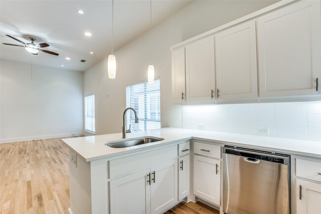Building Photo - Beautiful townhome featuring granite countertops, hard wood floors, and a small private yard grea...