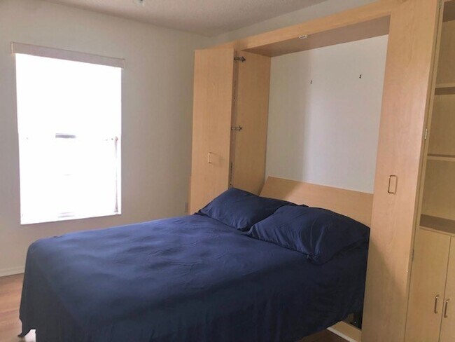 Building Photo - Nice 2X2 located on 2nd floor- Tile & lami...