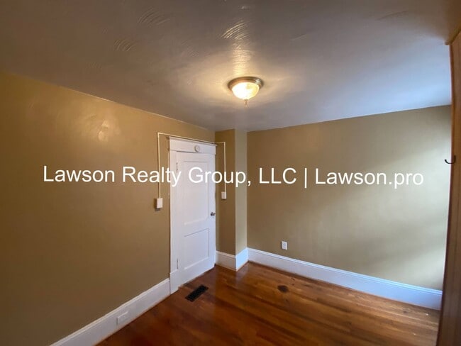 Building Photo - Updated Three Bedroom with Flat Yard