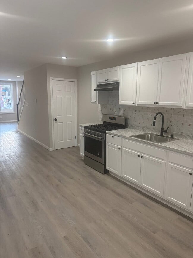 Building Photo - "Charming 4-Bedroom Townhouse in Trenton – Ideal Urban Living on MLK Jr. Blvd!"