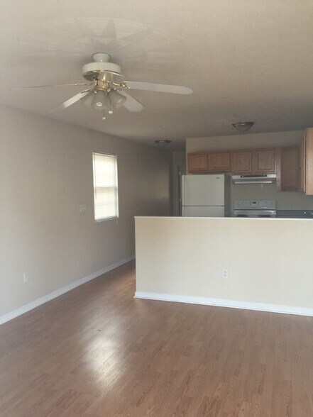 Spacious Living Room with bar divider into kitchen area - 1907 6th Ave