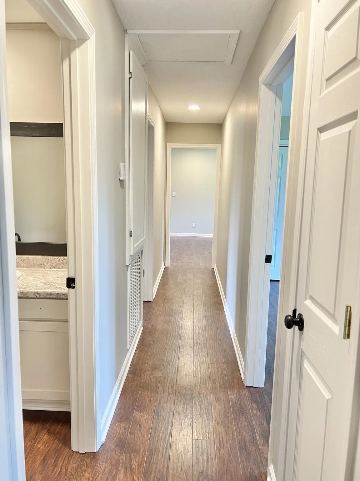 hallway with bathroom, storage closet, and 4 bedrooms - 3412 Camellia Cir