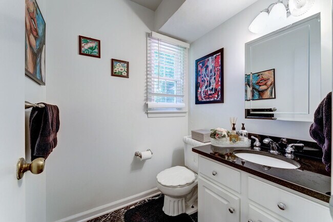 Main Level marble Powder Room off Family Room - 10108 Donegal Ct