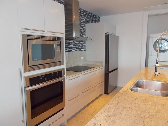 Building Photo - Experience elevated high-rise living at The Martin.