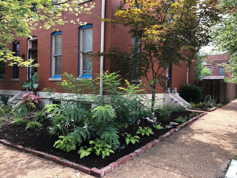 The front of the house, this house is on the corner of 3 attached townhouses. - 1626 Carroll St