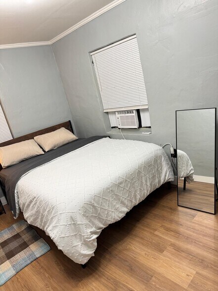 Queen bed with bedding sheets - 414 N 60th Way