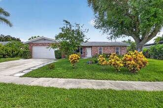 Building Photo - "Spacious & Renovated 4-Bed Oasis with Pool in Boca Raton - 2136 Sq Ft of Elegance!"