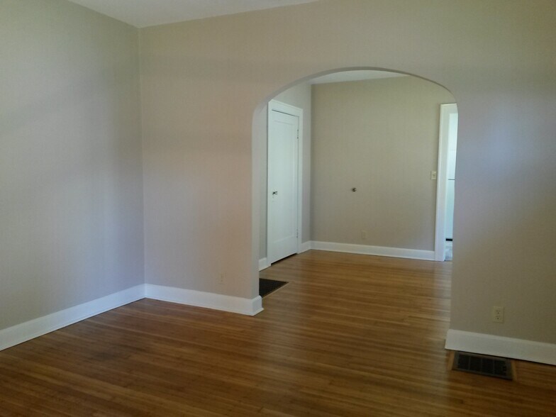 Archway and beautiful hardwood floors - 6036 N College Ave