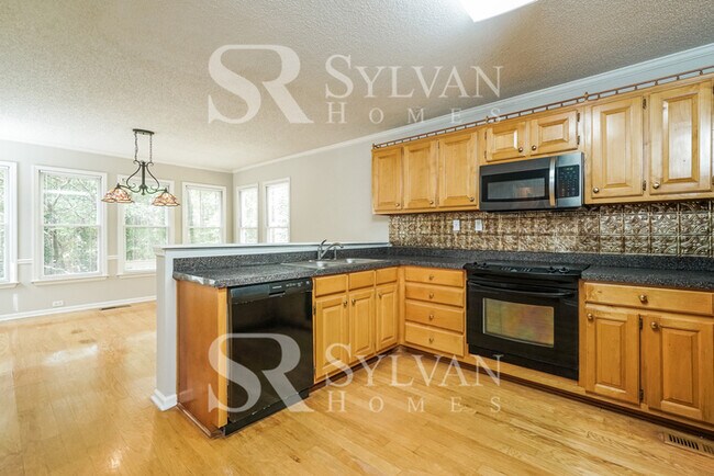 Building Photo - The living is easy in this 4 bedroom, 2.5 ...