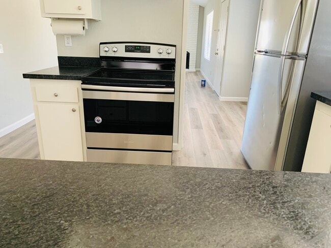 kitchen with new appliances - 6200 Quicksilver Ave