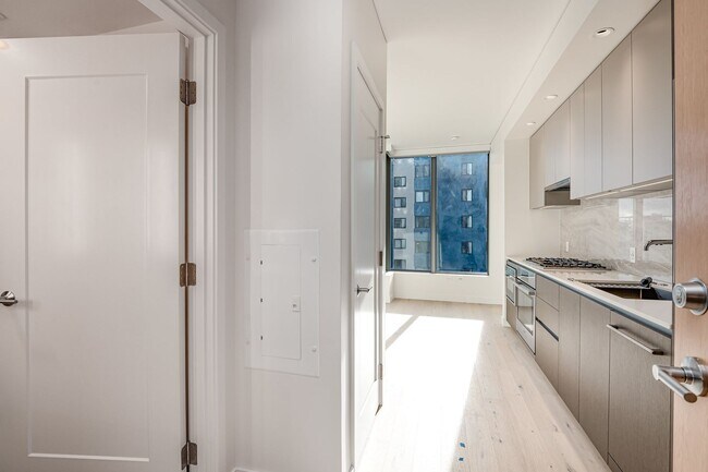 Building Photo - Urban Oasis at Spire Condominiums – Modern...