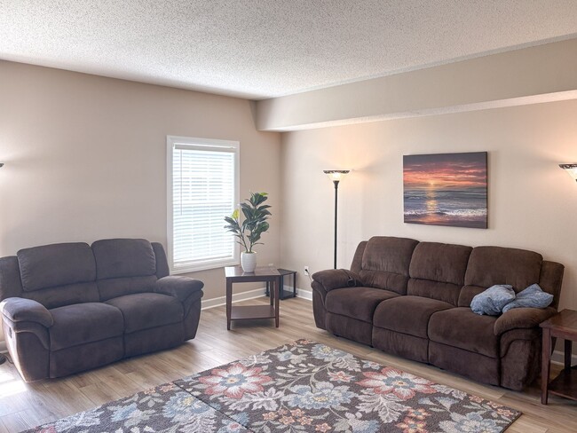 Building Photo - Fully Furnished 4-Bedroom Home with a Stocked Kitchen, Fenced Yard, and 2-Car Garage