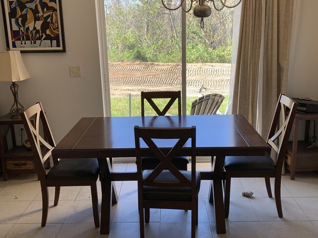 Dining table with backyard view! - 212 Winter Nellis Cir