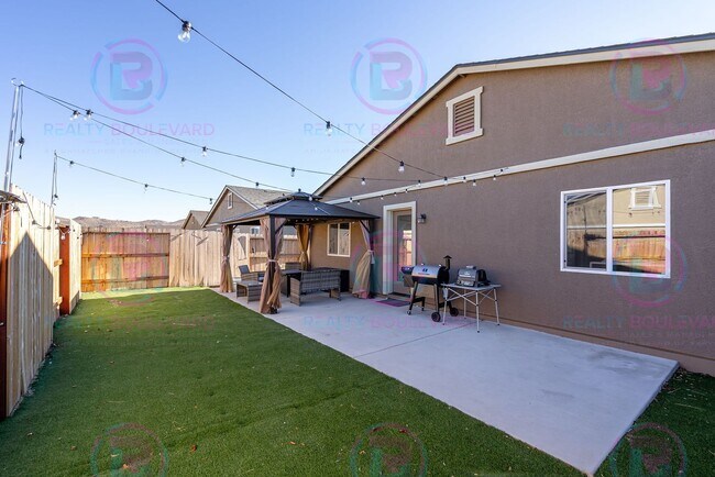 Building Photo - Spacious 4-Bedroom Lemon Valley Home with ...