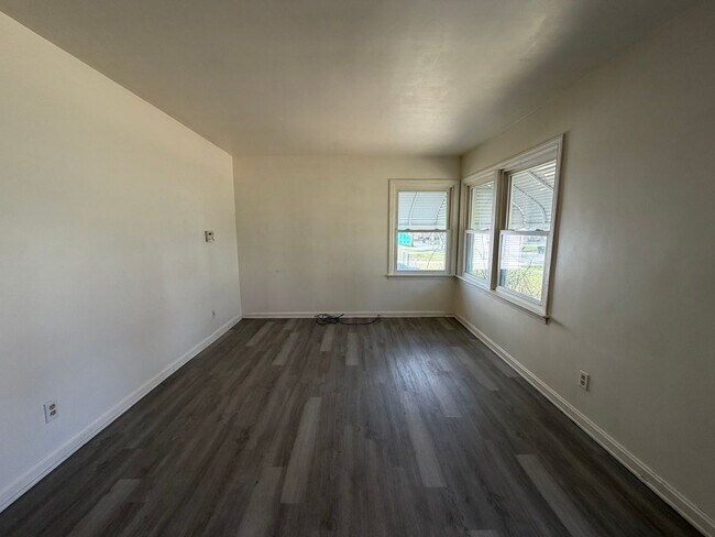 Building Photo - Bright Cape w/ Sunroom, Central Air, Big Basement & Backyard Shed