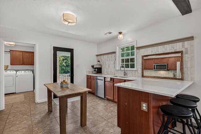 Building Photo - Charming Cow Horn Village Home with Outdoor Shower & Fenced Backyard