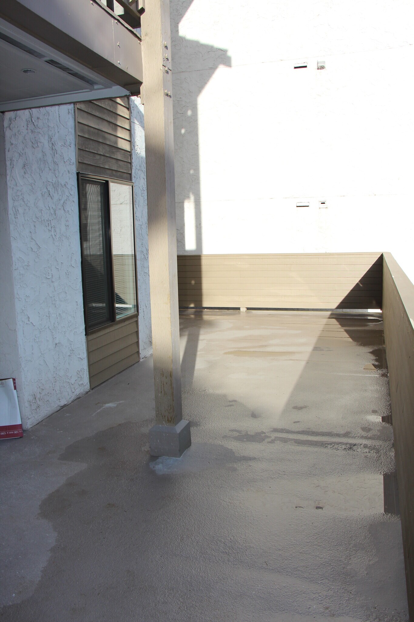 Huge private deck wraps around the unit and includes a covered area. - 10418 Northeast 32nd Place