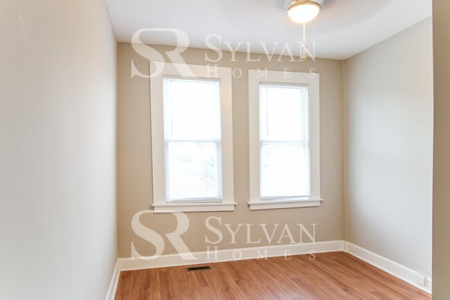 Building Photo - Welcome to this charming abode.