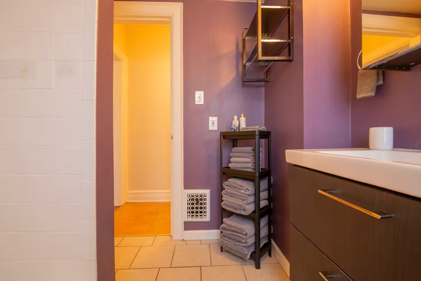 Clean and spacious bathroom featuring a tub. - 203 W Tupper St
