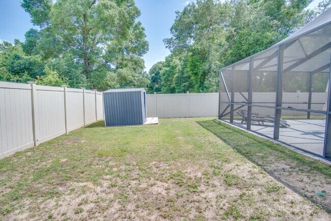 Building Photo - Milton 4BR Pool Home with Office, Vaulted Ceilings, Screened Saltwater Pool & 2-Car Garage