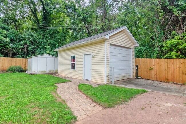 Building Photo - Space to Live, Room to Dream, 4BR/2BA with flex space, office, 2 car dettached garage and ample p...