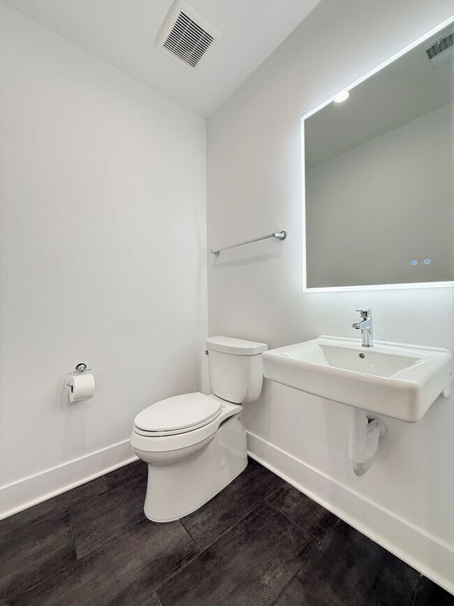 Building Photo - Brand new 4 level, 4 Bedroom Townhome with Elevator!