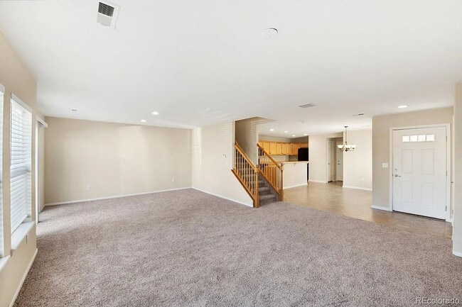 Building Photo - LEASING SPECIAL! Bright Open-Concept Condo with 1-Car Garage in Prime Commuter Location