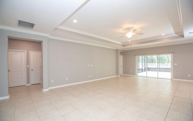 Building Photo - COMING SOON! Beautiful 4BR 3BA Home w/ Screened Lanai & Pond View • Garage Parking • Fenced Yard ...