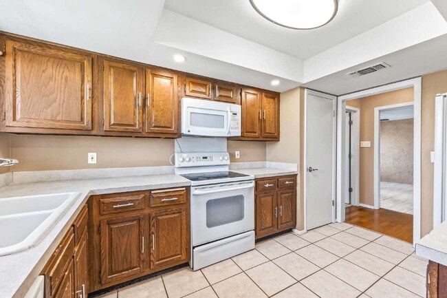 Building Photo - "Charming garden home offers 3-Bedroom Sanctuary with Cozy Fireplace in San Antonio – 1710 Sq Ft ...