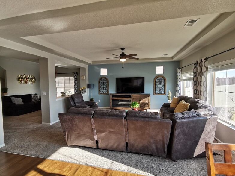 Large living room with lots of natural light - 17778 E 44th Ave