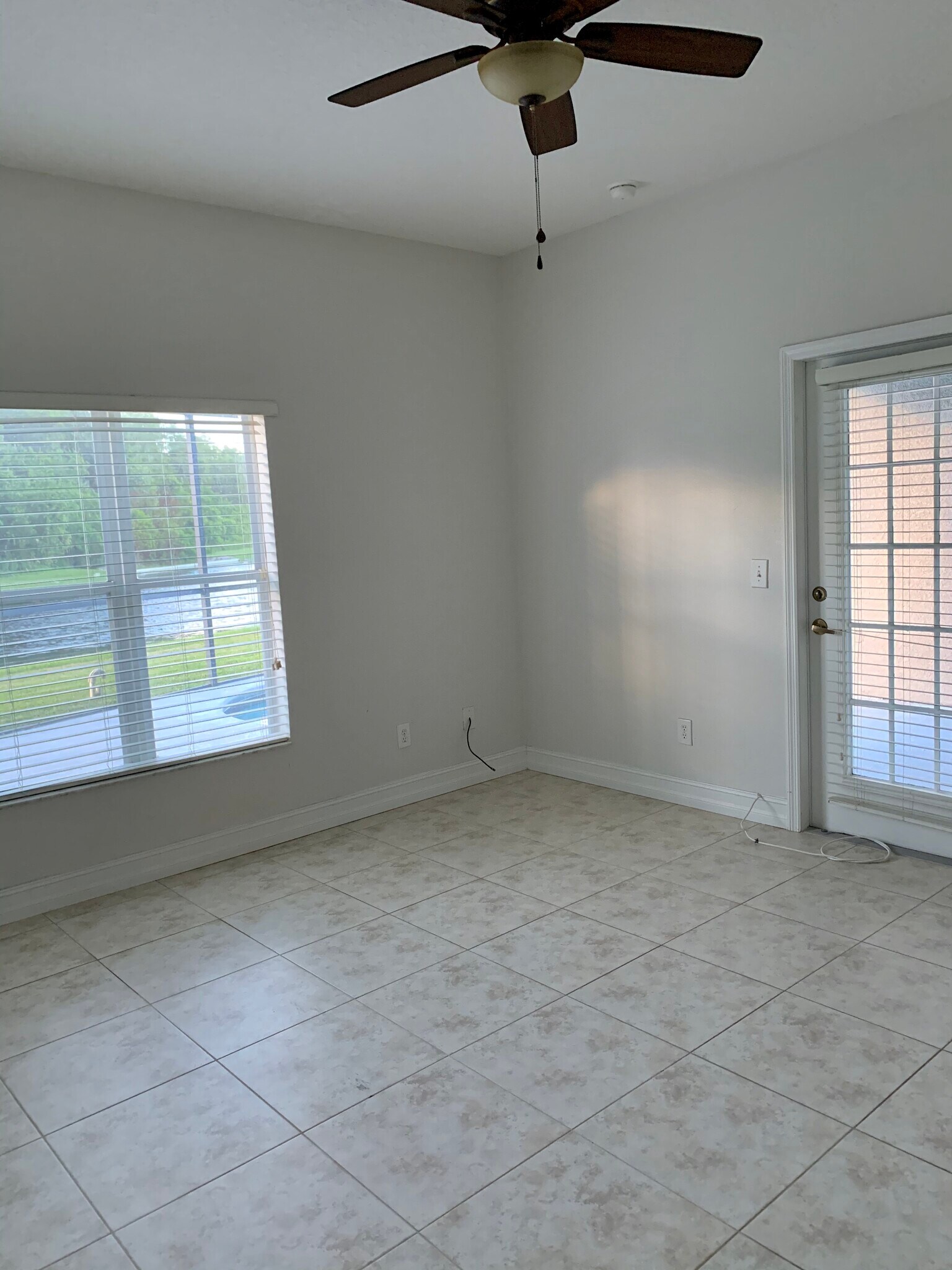 Master bedroom with door to pool area. - 1913 Magical Ln
