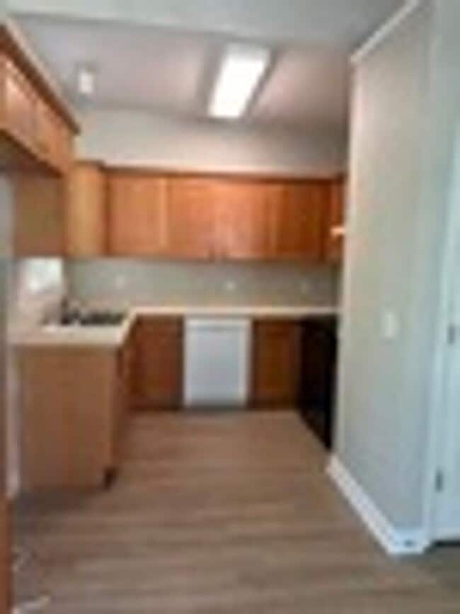 Building Photo - Great home with 2 separate entrances & a Fenced in yard!