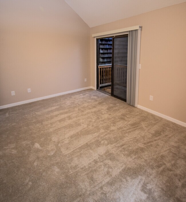 Main Bedroom with high slanted ceiling & sliding Doors to Private Deck - 115 Beechnut St