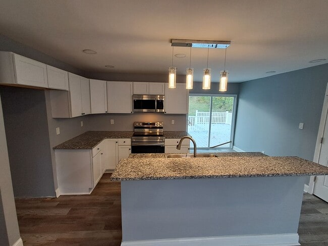 Building Photo - COMING SOON: Fully Renovated, Full of Charm — Space, Style, and a Porch Swing Vibe