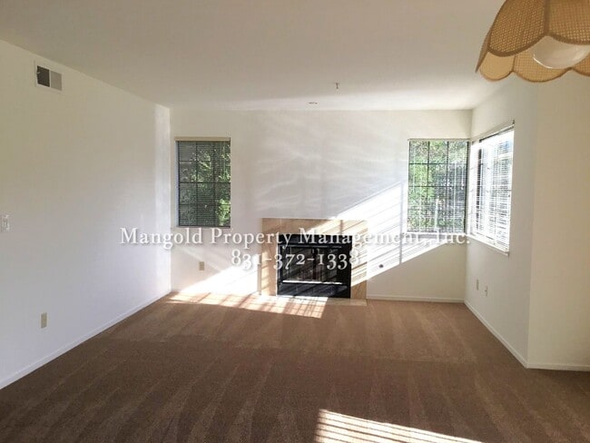 Building Photo - Spacious 2-Bed, 2-Bath Condo with Fireplac...