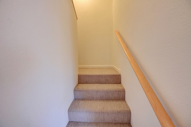 Unit 1011--Lighted and carpeted stairs lead to 2 bathrooms and 2 bedrooms - 2210 Miguel Chavez Rd