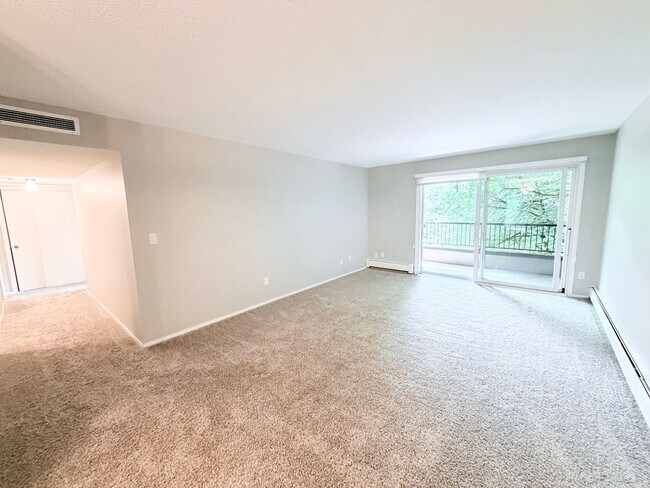 Building Photo - Large 1BR Condo with Patio, Heated Parking, Pool, Sauna & Tennis Courts!