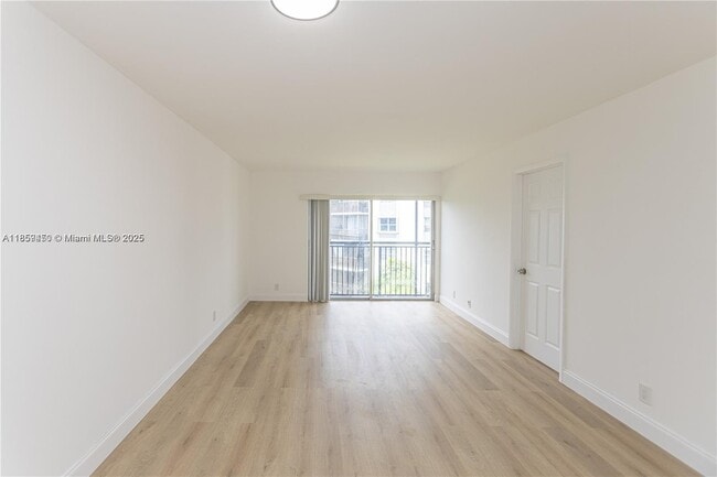 Building Photo - $2,100MONTHLY;8740 N SHERMAN CIR. #408 MIR...