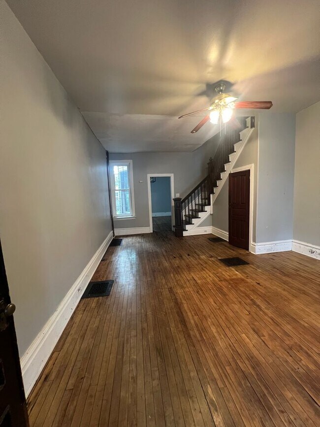 Building Photo - Renovated and Charming Townhome Available Now