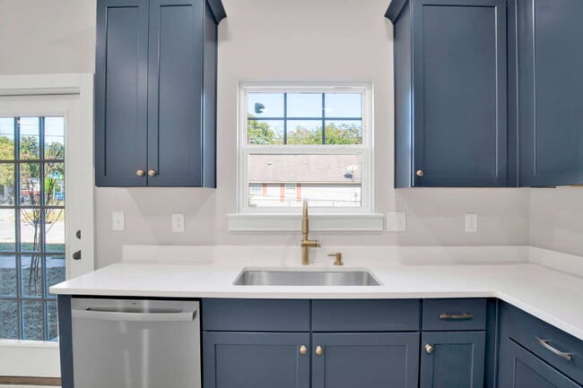 Building Photo - **Available now. This pet-friendly property features a small fenced yard with water and lawn main...