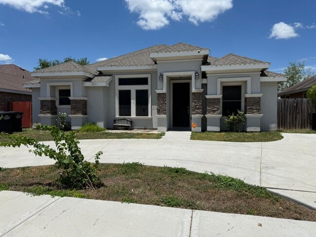 Building Photo - 1321 W Combes Ave